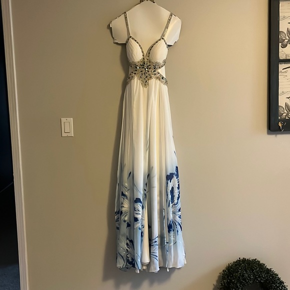 A Jasz Couture Beautiful white with blue florals formal dress with cut outs. - Picture 3 of 10